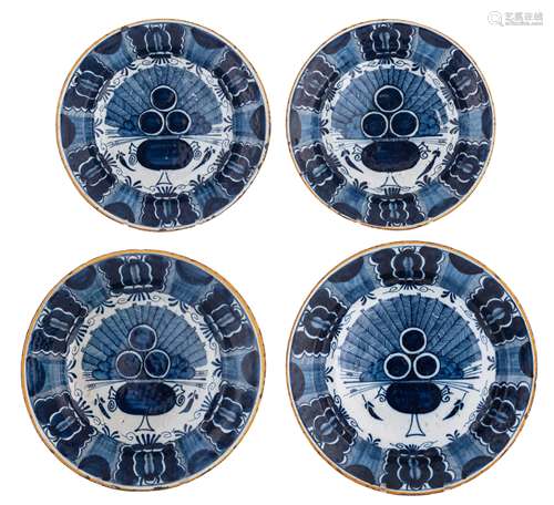 A collection of two large and two smaller blue and white 'peacock tail' decorated Dutch Delftware plates, marked  'De Drie Klokken', 18thC, ø 30,5 - 35,5 cm