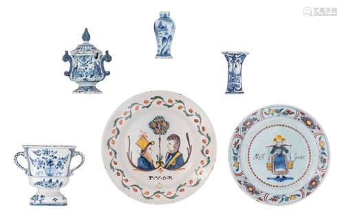 A collection of blue and white decorated Dutch Delftware items, consisting of a trophy vase, a small baluster vase, a mustard jar and a salt cellar, marked 'De Metalen pot', the rest with unknown marks, 18thC, H 9,5 -...