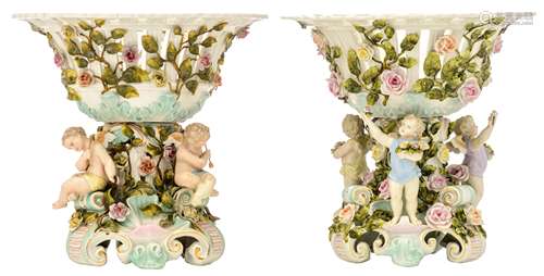 Two openworked baskets in porcelain, decorated with amors and angels holding flowers, marked 'Plaue', H 30 cm