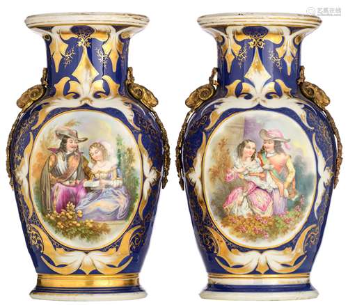 Two French blue ground porcelain vases with bronze mounts, the roundels decorated with gallant scenes, 19thC, H 49,5 cm