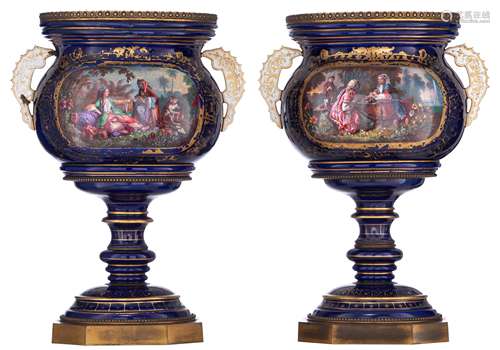 A pair of bleu royale ground Sèvres vases with brass mounts, the roundels polychrome decorated with hand-painted exotic scenes, signed 'Ab. Schilt, à la manuf. de Sèvres', H 49 cm