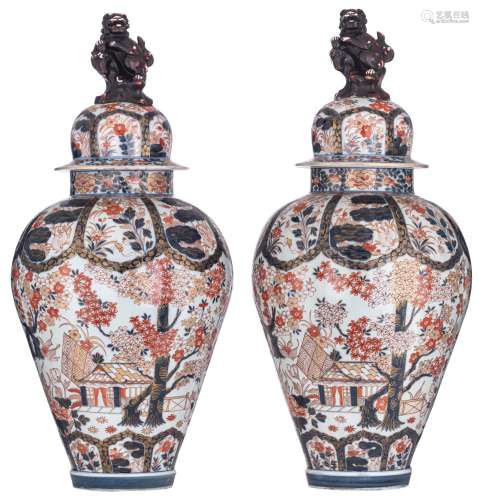 A large and imposing pair of Japanese Imari inspired Samson vases with covers, decorated with garden scenes and roundels filled with flowers and birds, on top two kylin-shaped knobs, H 91 - 91,5 cm