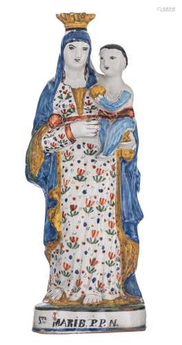 A polychrome decorated French pottery figure of the standing Madonna holding the Holy Child, with inscription 'Ste. Marie P.P.N.', probably Quimper, 19thC, H 40 cm