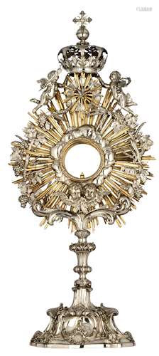 A (17)72 Bruges silver sunburst/solar monstrance by Carel Benninck, finely wrought with various style features, the alternate raying encircling the lunula is made out of gilt brass, (the lunula non-available), H 87 - ...