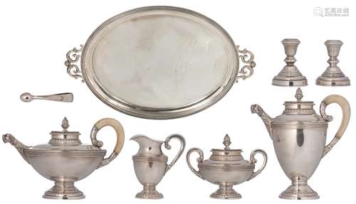 A German four-piece Neoclassical silver 925/000 coffee and tea set with ivory handles, on a matching tray. Added: a matching sugar tong, 800/000 and two Middle Eastern silver 900/000 candlesticks, total weight: about ...