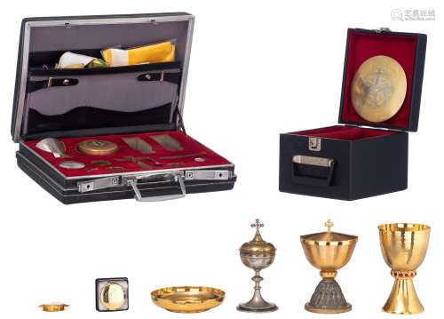 A collection of various modernist Catholic liturgical items, containing two gilt brass Cibori (one with a silver-plated decoration depicting Christ and his 12 apostles and with the inscription 'Ghislain Dekeyrel', bot...