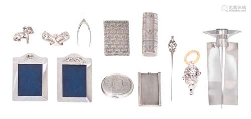 A various collection of English sterling silver items, containing: an Art Deco candle holder (hallmarked London with a date letter of 1935, H 18 cm, weight: 340 g). A pair of 20thC London hallmarked silver photo frame...