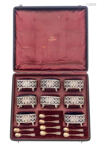 A set of eight Neoclassical silver salts with the blue glass liners and the matching spoons, French hallmarks, maker's mark P.Frères (1868-1888), 950/000, in its original leather case marked L. Béguin et L. Lapar, mon...