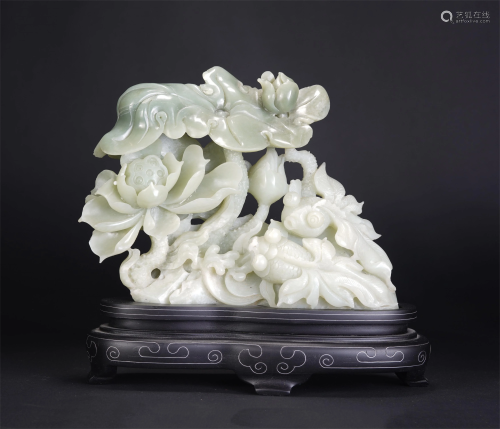 A CHINESE WHITE JADE CARVING OF LOTUS AND FISHES