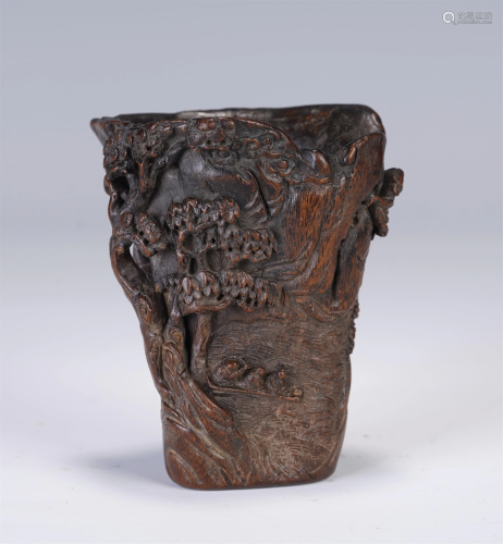 A CHINESE CARVED HARDWOOD CUP