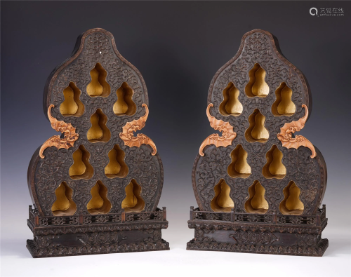 A PAIR OF CHINESE CARVED HARDWOOD GOURD BUDDHIST