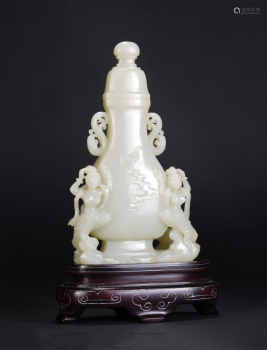 A CHINESE CARVED WHITE JADE VASE WITH COVER