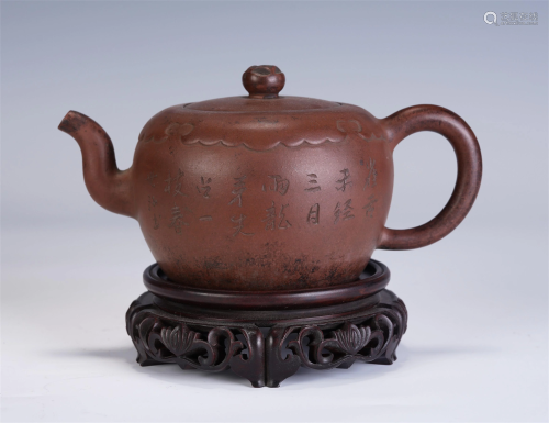 A CHINESE CARVED YIXING CLAY ROUND TEA POT