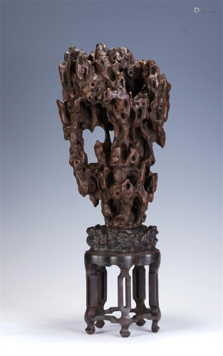 A CHINESE CARVED FREE-FORM HARDWOOD DECORATION