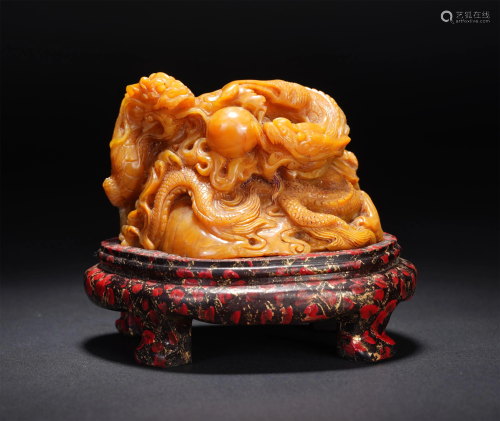 A CHINESE SOAPSTONE CARVING OF DRAGONS