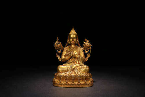 A GILD BRONZE TSONGKHAPA ORNAMENT