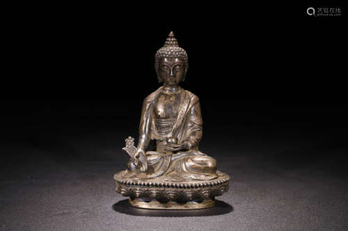 A SILVER SAKYAMUNI STATUE