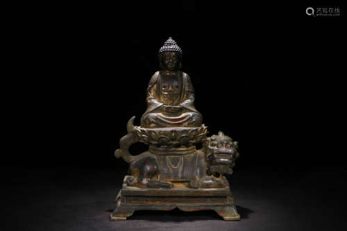 A BRONZE BUDDHA STATUE OF SAKYAMUNI RIDING A LION