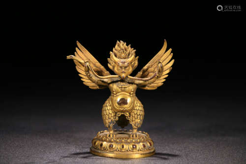 A GILD BRONZE ROC BUDDHA ORNAMENT