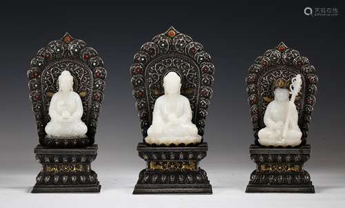 Three Carved White Jade And Silver Seated Buddhas