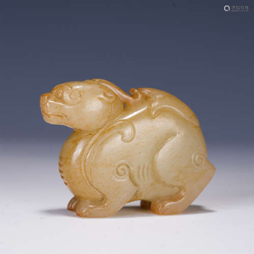 A CHINESE JADE CARVED FOO-DOG SHAPED