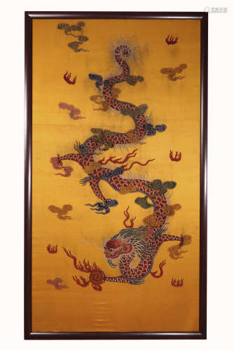 A CHINESE YELLOW GROUND HANGED SCREEN WITH DRAGON AMONGST THE CLOUDS