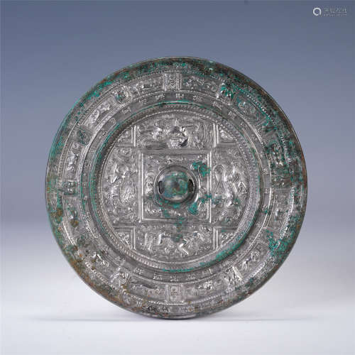 AN UNUSUAL CHINESE BRONZE ROUND MIRROR