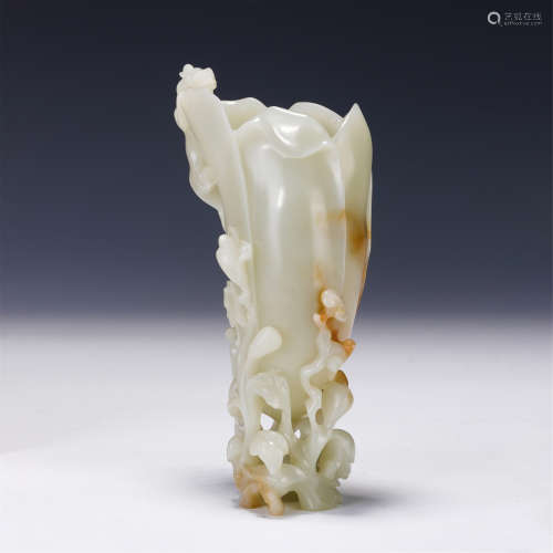 A CHINESE CARVED WHITE JADE FLOWER HOLDER
