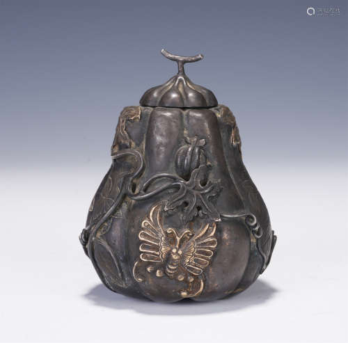 A CHINESE PURE SILVER CARVED MELON SHAPED BOX AND COVER