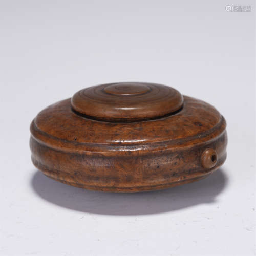 A CHINESE WOOD CARVED WATERPOT WITH SCHOLAR TOOL