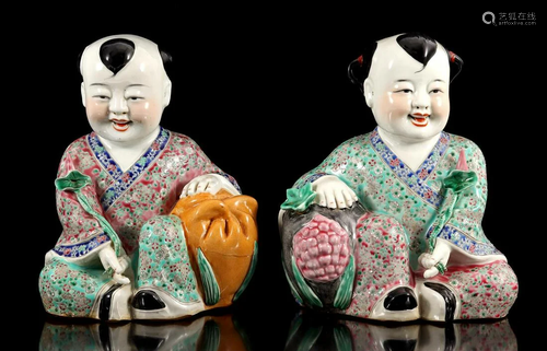 2 porcelain statues of seated figures with flowers