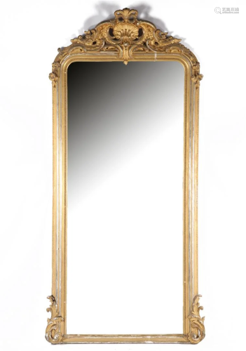 19th century mirror in a richly decorated wooden frame