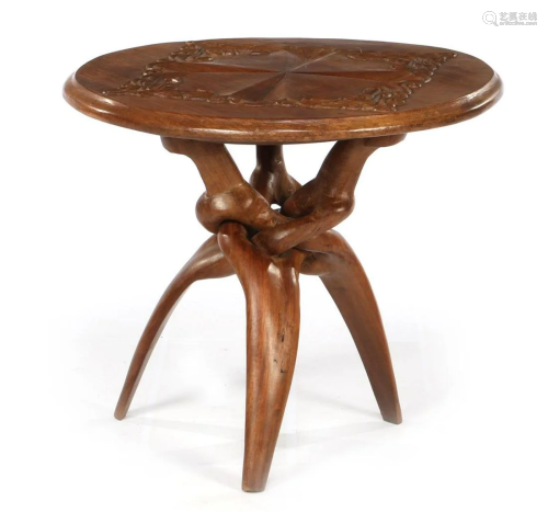 African wooden table with carved decoration