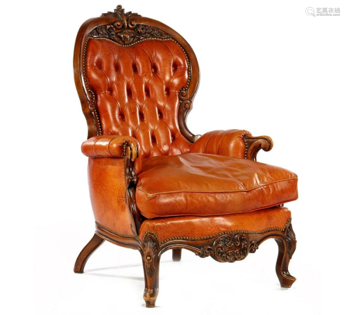 Walnut armchair with stitching and beautiful crest