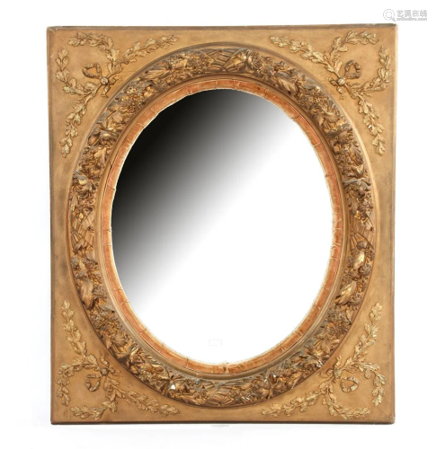 Oval mirror in a carved 19th century frame