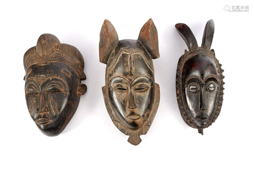 3 African tribal wooden bombarded masks