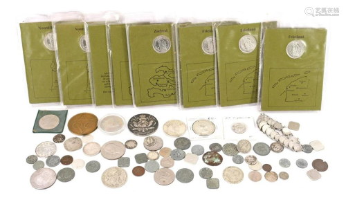 Bag with various coins including folders with