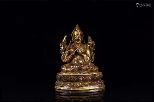 A Chinese Gilt Bronze Figure of Buddha