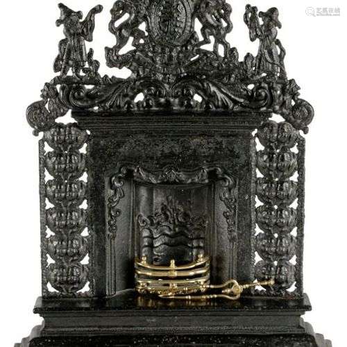 A VICTORIAN CAST IRON MINIATURE FIREPLACE MID 19TH…