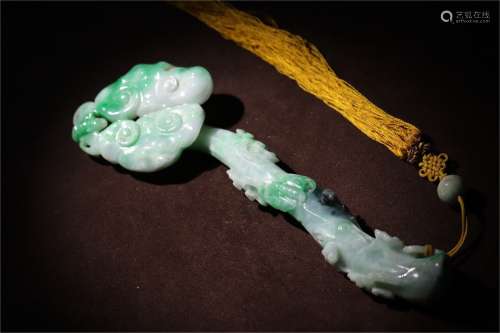 A Chinese Carved Jadeite Ruyi