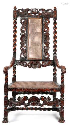 19世纪威廉与玛丽风格的胡桃木扶手椅，雕有王冠、贝壳、神话中的鸟头和鱼身，有卷叶，有藤条背和座椅，前脚有爪子，出处为已故简-萨姆纳的遗产。