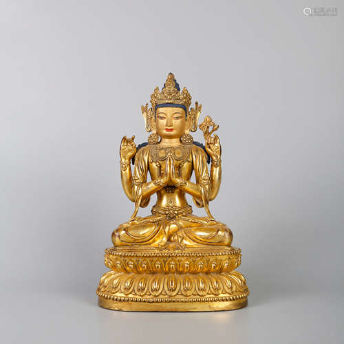 A GILT-BRONZE BODHISATTVA STATUE OF FOUR ARMS