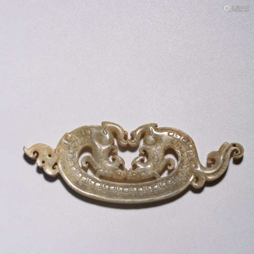 A JADE CARVED DRAGON PENDANT