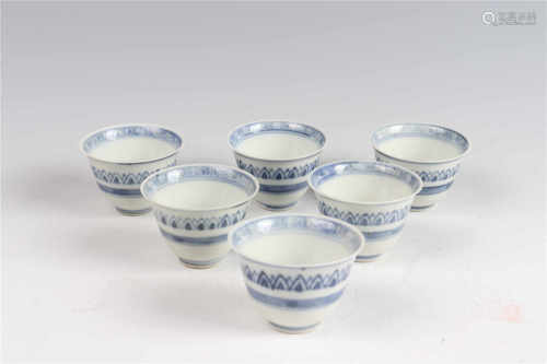A group of blue and white cups