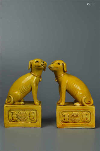 A pair of yellow glazed beasts