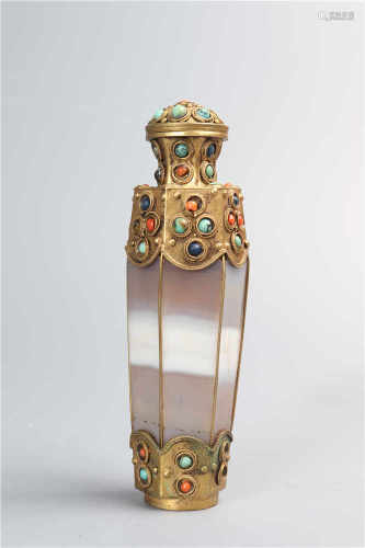 A snuff bottle inlaid with precious stones