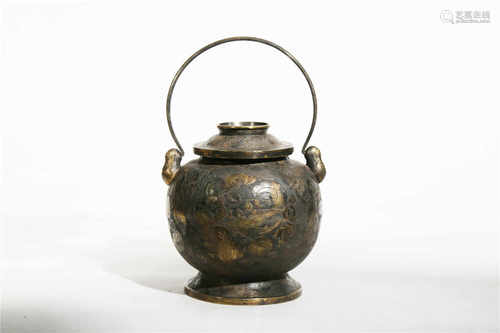 A gilded silver teapot