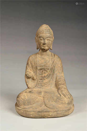 A carved stone buddha statue