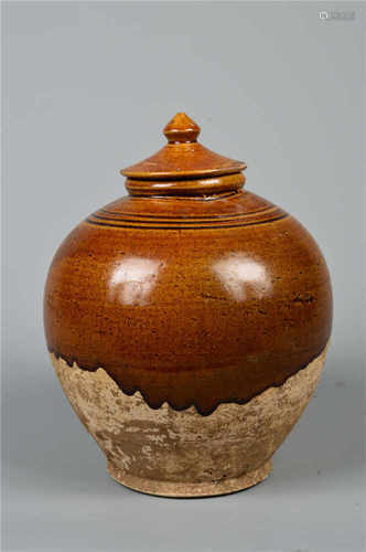 A yellow glazed jar