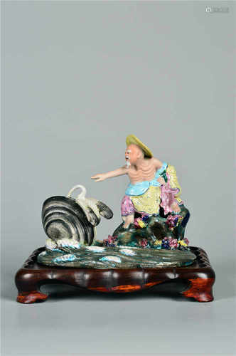 A porcelain fisherman